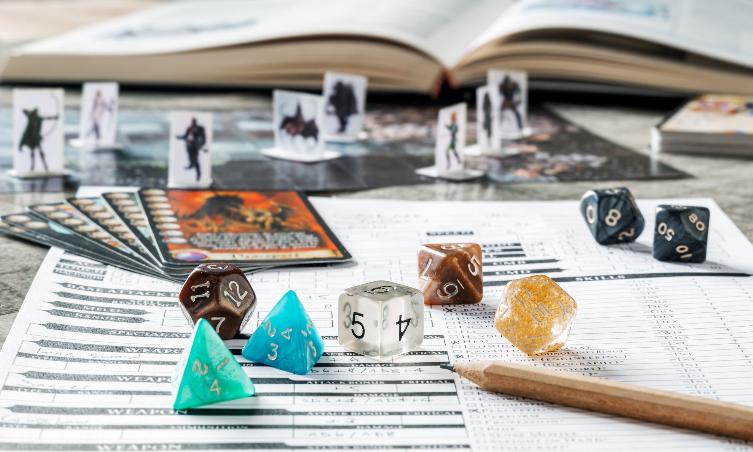 A role-playing game is set up on a table, with dice, cards, and characters.
