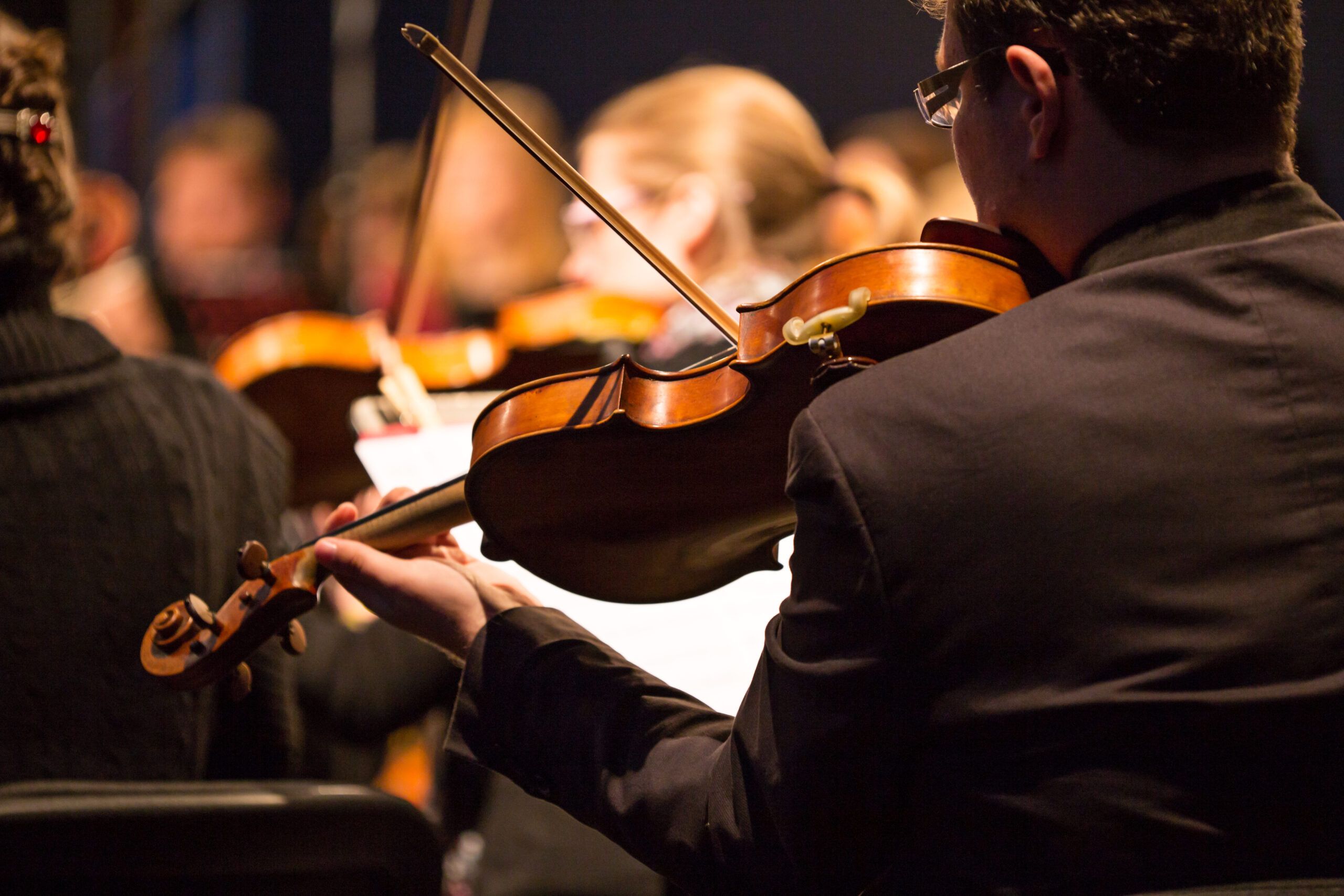 A violin player during a symphony performance.