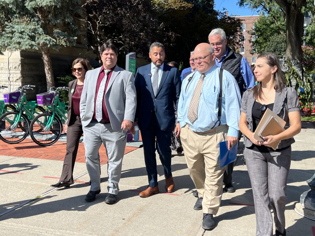 Glens Falls Mayor Bill Collins (left) and economic development director Jeff Flagg (right) walk with New York Secretary of State Robert Rodriguez (middle) during a tour of DRI projects last week. The City is holding two public meetings this week to discuss progress and updates on DRI initiatives. Photo by Dylan McGlynn